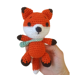 Crocheted fox with a little...